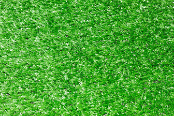 Fototapeta premium Artificial green grass texture, soccer field background for sports design and content