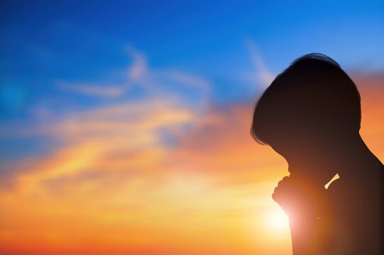 Young Christian person praying to God