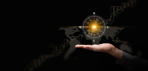 Business strategy and direction concept. Hand with digital compass over global map and rising financial chart, Decision making, strategic planning, leadership vision, and corporate business success © OleCNX