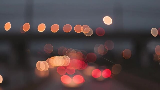 Blurred orange and red lights create a beautiful bokeh effect at night