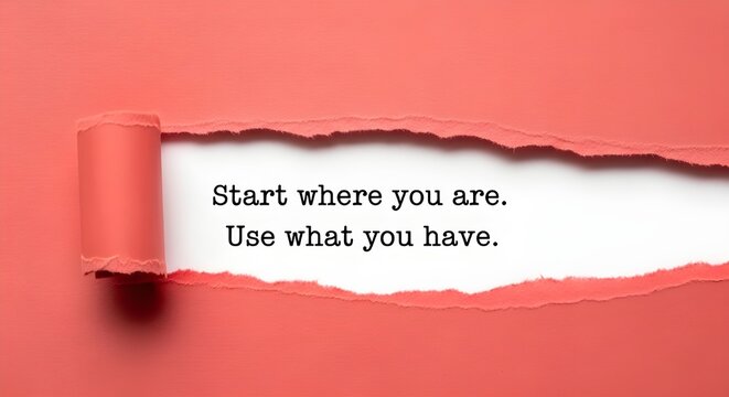 A creative concept featuring typewriter-style text that reads, "Start where you are. Use what you have," revealed through a horizontal tear in vibrant red kraft paper.