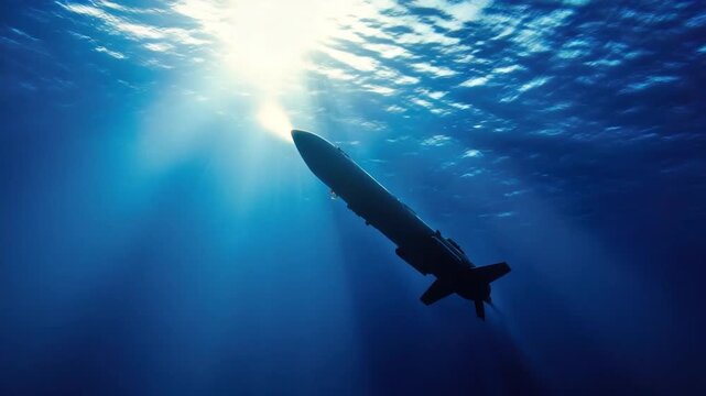 A commercial airliner flies high above the clouds, with a bright blue sky as its backdrop