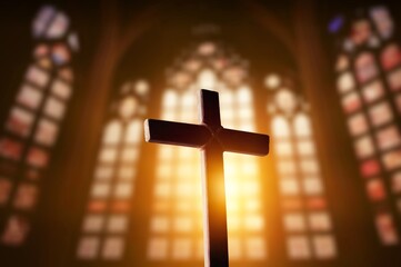 Silhouette of wooden cross inside antique church