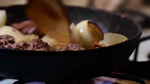 frying grease beef and onion , close up, home cooking, selective focus video