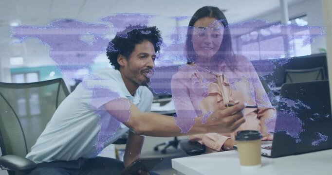 Glancing at laptop, male leaning and showing phone, female watching for business under world-map