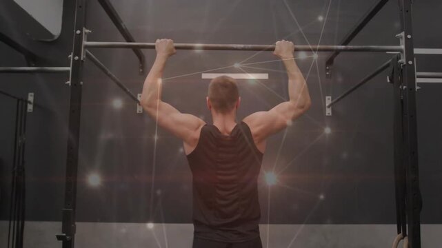Man gripping pull-up bar and performing pull-ups in gym, particle network highlighting muscle gain