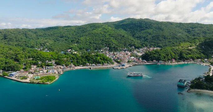 Modern buildings in town city at coastline in Romblon Island. Romblon, Philippines.