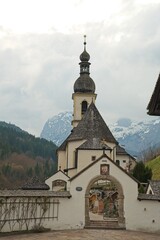 Fototapeta premium view to historical cemetery and parish church of St. Sebastian in Ramsau in Bavaria