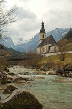 famous view in Ramsau over the Ramsauer Ache river to the parish church of St. Sebastian