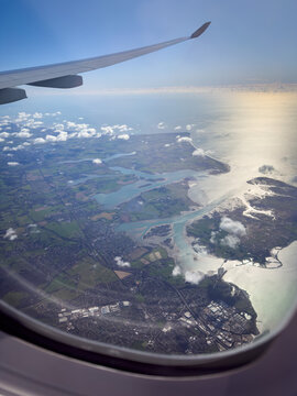 An aerial view from a plane of the Solent, the entrance into Chichester Harbour and Hayling Island area of Portsmouth.