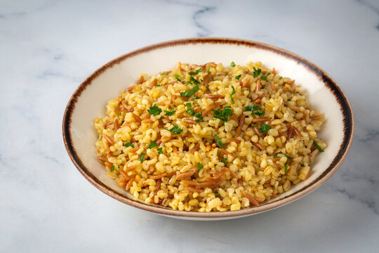 Traditional delicious Turkish food, bulgur pilaf with vermicelli (Turkish name; arpa sehriyeli bulgur pilavi)