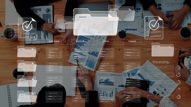Overhead view of a collaborative workspace featuring digital files and progress indicators, illustrating teamwork and productivity in project management. Raster