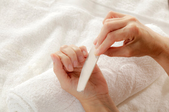 Female hands on light background &ndash; hand care and beauty wellness concept. Copy space for advertising cosmetics, moisturizing creams, spa and beauty salons, skincare products, and wellness services.