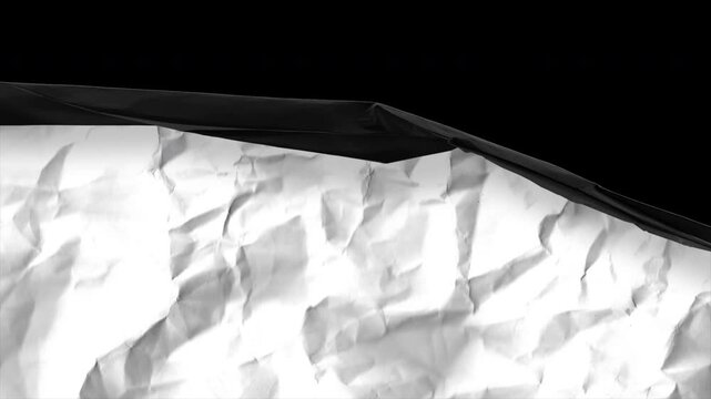 Crumpled paper under spotlight