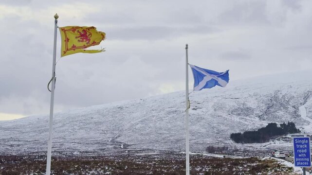 The scottish flag waving in the Highlands. Glencoe, Scotland, UK.