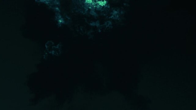 A powerful explosion of green neon flames and toxic smoke on a black background. A realistic 3D simulation of a magical fireball with high detail for VFX editing, sci-fi movies, and game design