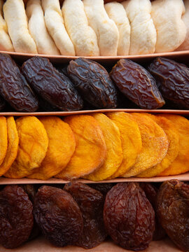 Healthy eating concept. Close-up of a dried fruit mix of dates, plums, apples, and peaches.