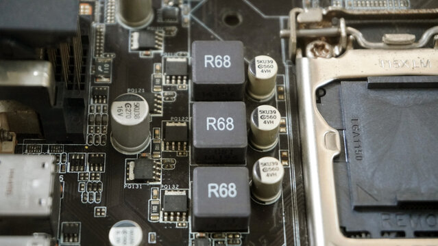 Close-up of a motherboard's VRM components and capacitors near the CPU socket.