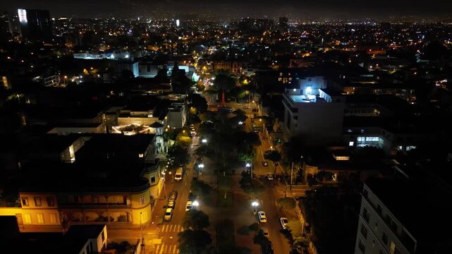 Aerial night view of the illuminated monument to Don Jose de San Martin in the coastal district of Barranco.