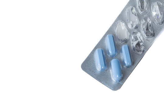 silver blister pack of blue naproxen capsules for pain relief on white background