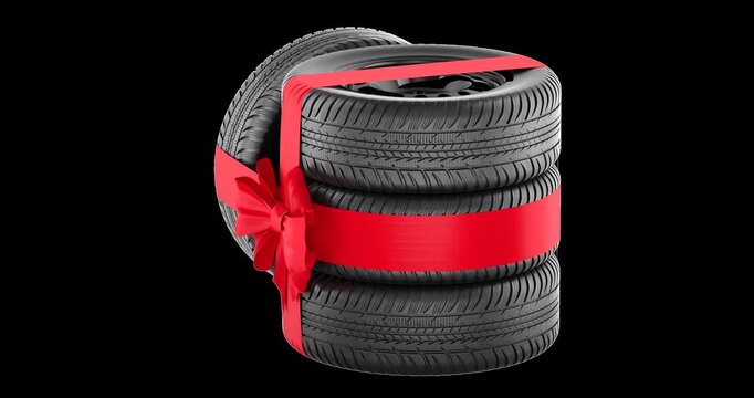 Set of car tires with a red ribbon and bow, rotation animation seamlessly loopable. 3D rendering isolated on transparent background