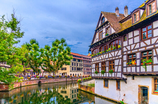The Petite France Quarter, Place Benjamin-Zix square quay embankment of River Ill canal with half-timbered houses medieval buildings in old town Strasbourg city historic Centre, Alsace region, France