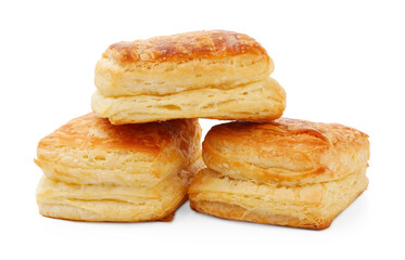 Tasty baked puff pastries isolated on white