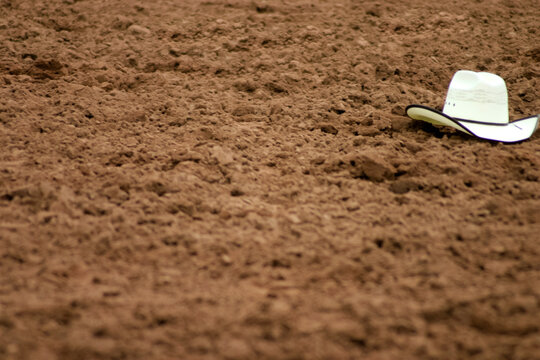 Galisteo, New Mexico, United States. Rodeo hat left in dirt at Galisteo Rodeo.