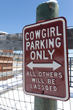 Santa Fe, New Mexico, United States.    Humorous parking sign for cowgirls only. 