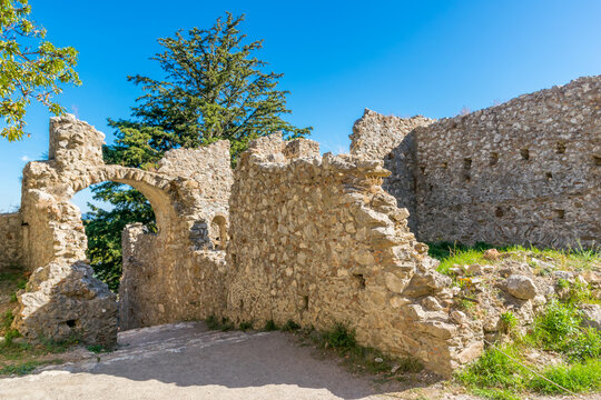 Arched entrance to the Mystras archeological site and byzantine town with ruins of fortification wall, Laconia, Peloponnese, Greece