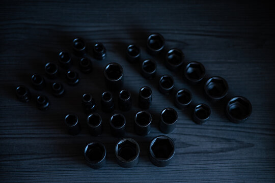 High-performance impact sockets dominate the foreground, showcasing their precision 6-point (hexagonal) broaching and heavy-duty side walls.