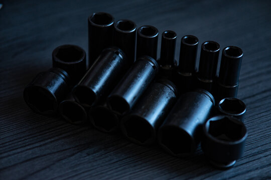 High-performance impact sockets dominate the foreground, showcasing their precision 6-point (hexagonal) broaching and heavy-duty side walls.