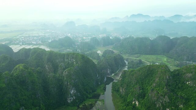 Aerial view of a river valley with karsts in Tam Coc, Ninh Binh, Vietnam
