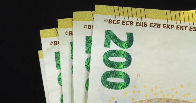 European Money. Euro banknotes, EUR. New two hundred Euro banknotes. One thousand Euros in five 200 euro banknotes. Cash, finance, savings, wealth