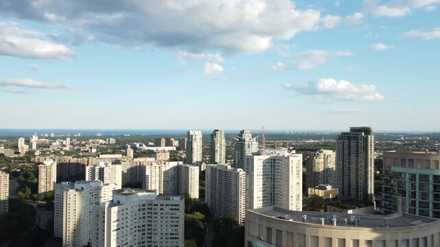 Aerial view of downtown Mississauga, Ontario, Canada, south of Burnhamthorpe Road. Panning right, looking south to the landmark buildings. Shot on a beautiful summer late afternoon.