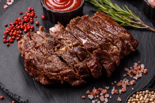 Steak, beef or pork meat grilled or barbecued with salt and spices. Beef steak