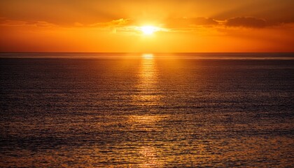 Fototapeta premium Beautiful Sunrise Over The Ocean With Golden Light Reflecting On The Water Surface