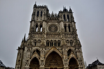Amiens, France &ndash; November 12th 2016: Frontal view of Cath&eacute;drale Notre-Dame d'Amiens, a masterpiece of Gothic architecture with its monumental fa&ccedil;ade.
