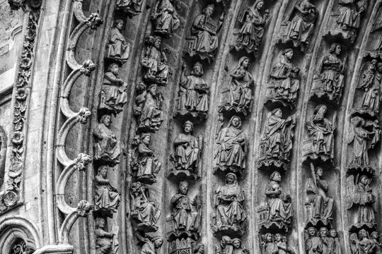 Amiens, France &ndash; November 12th 2016: Gothic archivolts of Cath&eacute;drale Notre-Dame d'Amiens portal, decorated with intricate sculpted figures and ornamental patterns.
