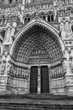 Amiens, France &ndash; November 12th 2016: Main portal of Cath&eacute;drale Notre-Dame d'Amiens showing doorway, tympanum and archivolts, masterpiece of Gothic architecture.
