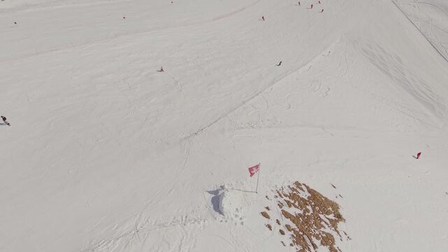 Winter tourism in the Alps: drone view of the Grindelwald First station and mountain peaks.