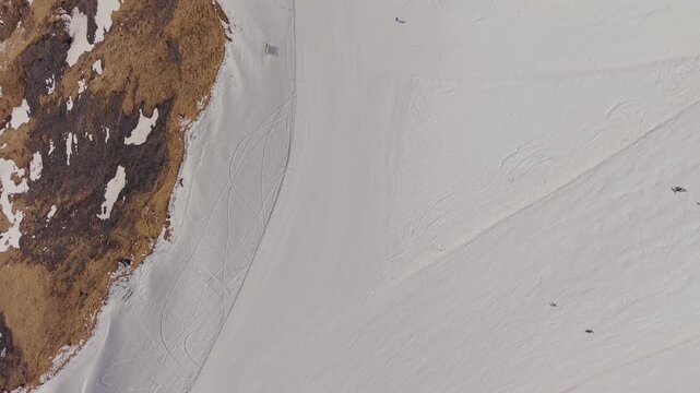 Winter tourism in the Alps: drone view of the Grindelwald First station and mountain peaks.