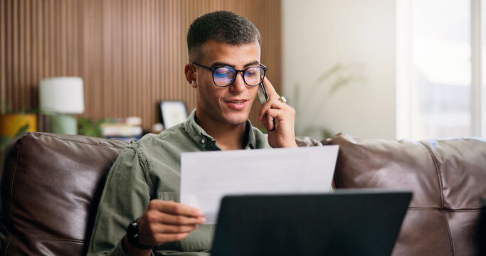Happy man, documents and phone call with laptop on sofa for financial planning, audit or investment. Person, paperwork or talking with mobile smartphone for insurance policy or agreement in house