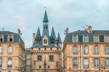 Fototapeta premium Porte Cailhau historic medieval gate and surrounding classical architecture in Bordeaux city center, Gironde, Nouvelle-Aquitaine, France. French old town buildings. Travel and touristic landmark
