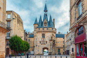 Fototapeta premium Porte Cailhau historic medieval gate and surrounding classical architecture on Place du Palais in Bordeaux city center, Gironde, Nouvelle-Aquitaine, France. French old town square