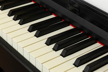 Naklejka premium Close-up of black and white piano keys on a grand piano keyboard