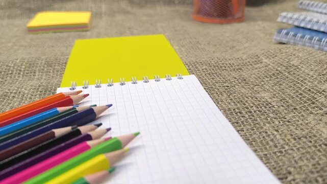 Close-up of fountain pen lying on blank notepad 