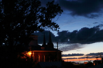 The silent church spires embracing the last golden embers of dusk