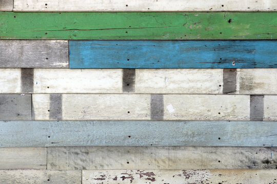 Colorful wooden wall made of boards. Vintage background backdrop