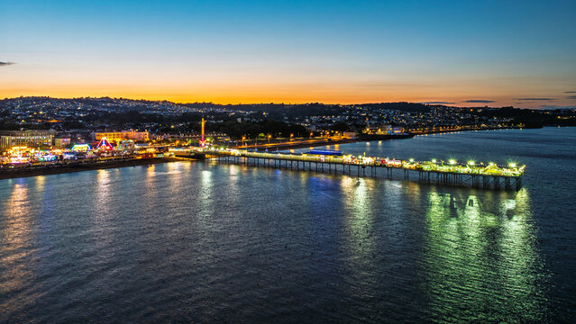 Night view of Paignton Pier and Beach from a drone, Paignton, Devon, England, Europe